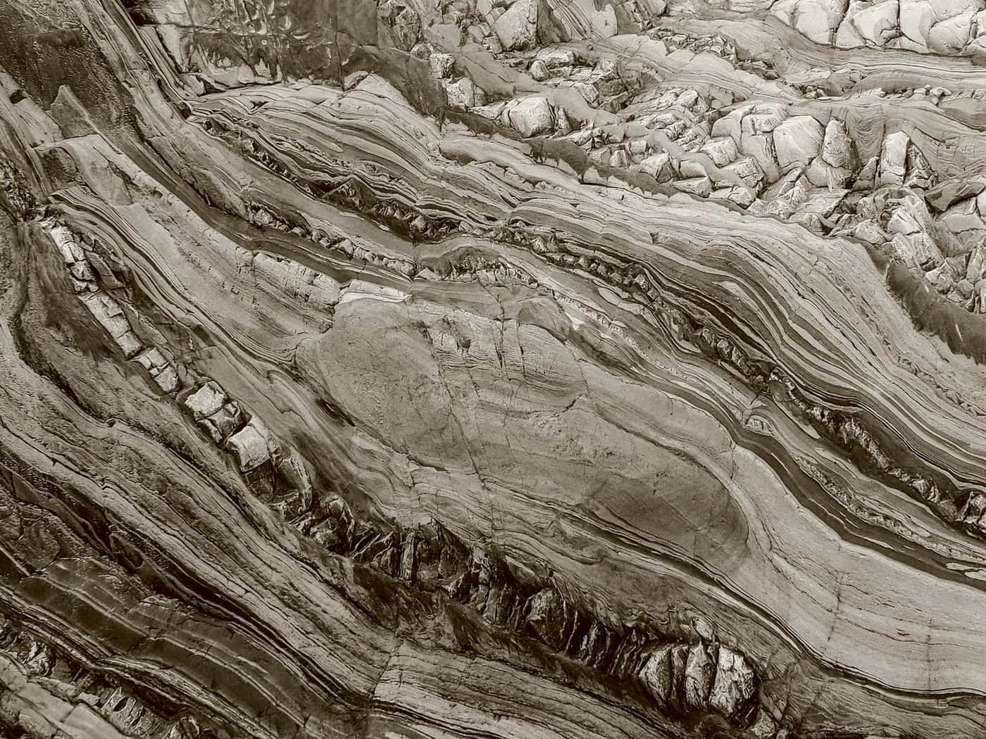 Layered rock strata in bronze duotone